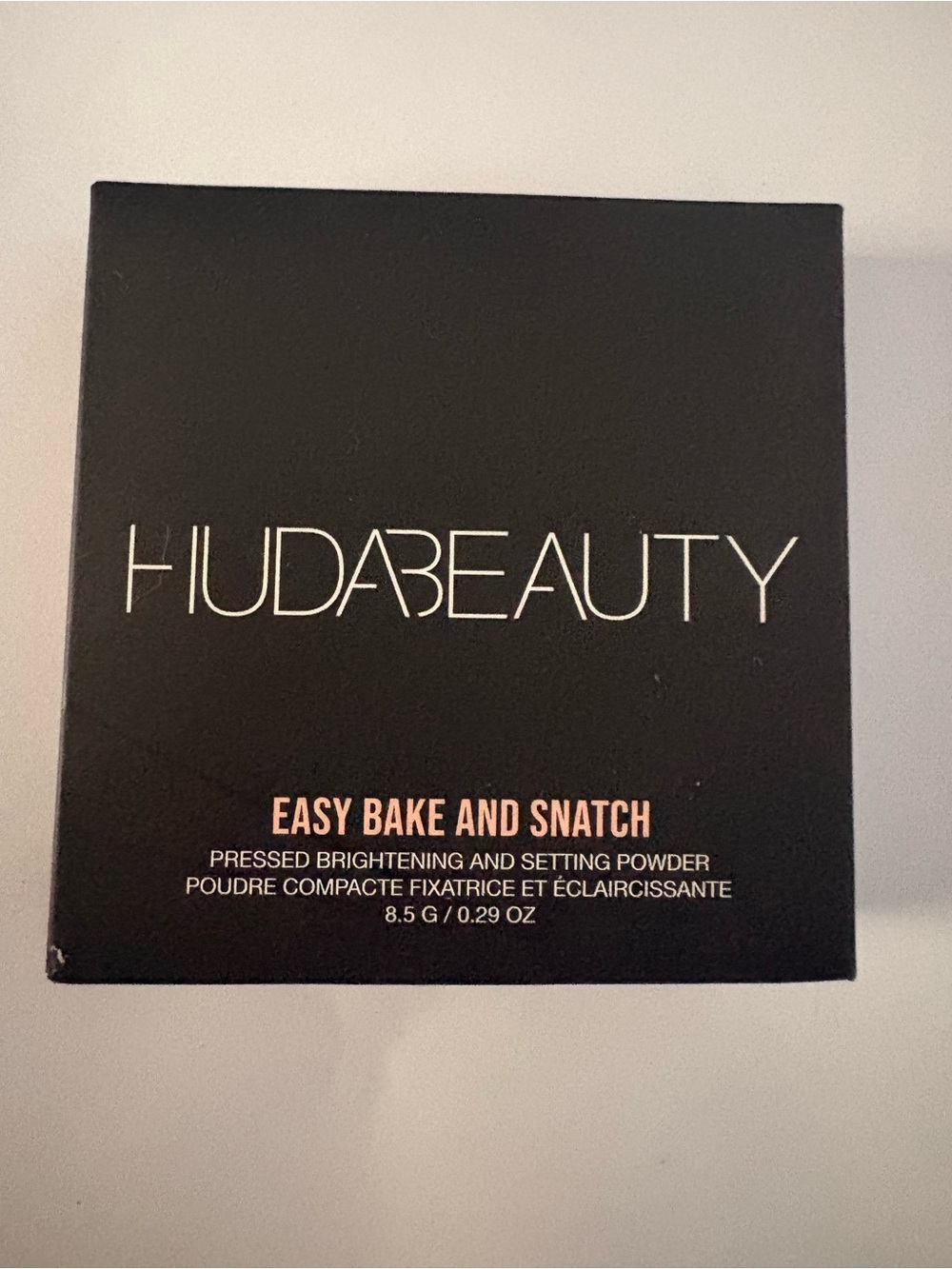 HUDA BEAUTY Black Compact Powder Box with White Text